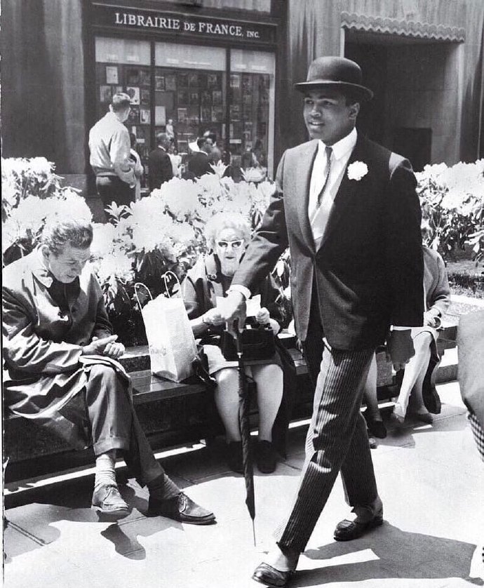 Cassius Clay (Muhammad Ali)  walking thr